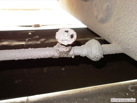 Balancing pipe between two diesel tanks of a power car - vulnerable to be damaged by ballast hitting