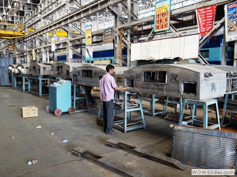 Artisan Staff attending AC unit in Workshop